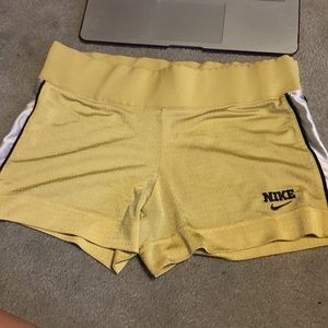 Gold Nike shorts